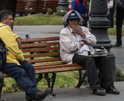 A typist waits in the Plaza de Armas for customers who need offical documents typed